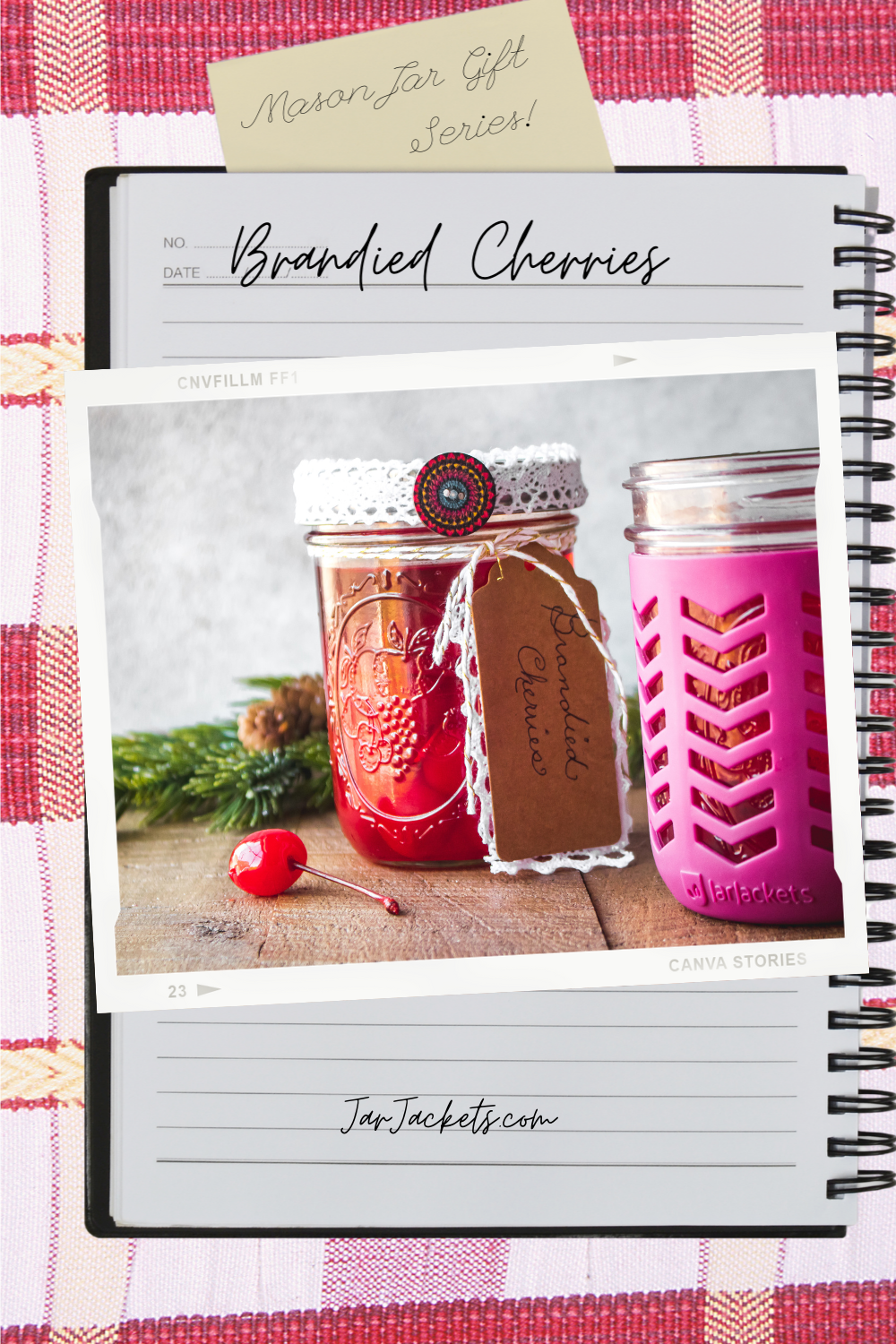 A mason jar filled with brandied cherries and festooned with a pretty red ribbon and homemade gift tag.
